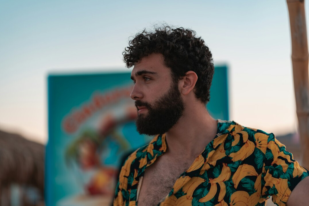 Bearded Brazilian man founder in a patterned shirt
