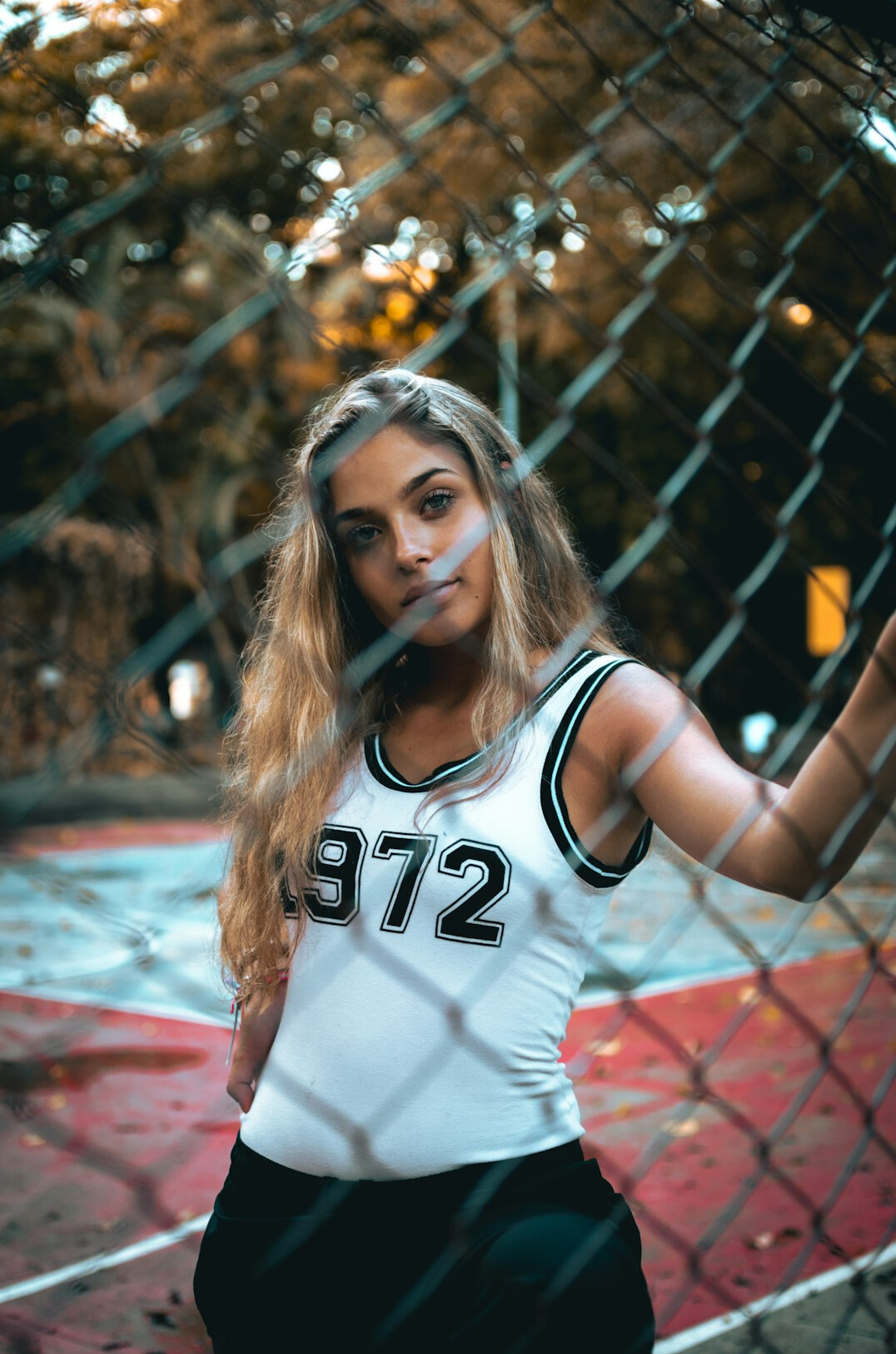 Brazilian woman coach with blonde hair looking confident